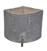 An early George III lead corner basin, with applied lead script I H 1763, above a later fitted