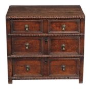 A Charles II oak chest of drawers, circa 1660, the bead moulded top above three long drawers, 70cm