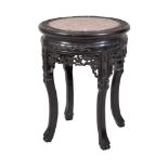 A Chinese hardwood stand, with pink inset marble top, 52cm high, 42cm diameter Provenance: 9, The