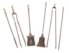 A set of three steel and brass mounted fire tools , 19th century, comprising shovel, poker and