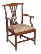 A George III mahogany armchair, circa 1770, the pierced vase splat incorporating Gothic motifs, the