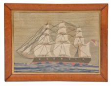 A Victorian sailor's woolwork picture of a three masted ship, circa 1880, square rigged and