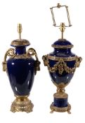 Two similar blue ceramic and gilt metal mounted table lamps , late 20th century, each with flanking