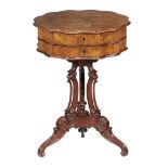 A French figured walnut work table , circa 1870, 73cm high, the shaped top 70cm diameter overall