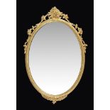 A Victorian giltwood and composition oval wall mirror , circa 1870, 76cm high, 49cm wide