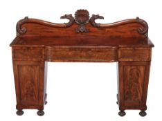 A Regency mahogany pedestal sideboard, circa 1815, probably Scottish, the rear gallery with central