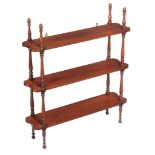 A flight of Victorian mahogany hanging wall shelves , mid 19th century, each shelf divided by