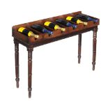 A mahogany bottle rack on stand, early 19th century and later, to take six bottles, 77cm high,