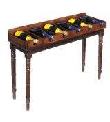 A mahogany bottle rack on stand, early 19th century and later, to take six bottles, 77cm high,