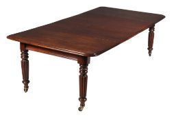 A George IV mahogany extending dining table, circa 1825, in the manner of Gillows, the rounded