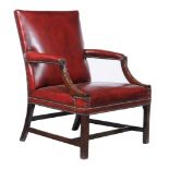 A mahogany and leather upholstered armchair, early 19th century and later, with carved lattice and