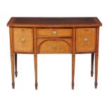A George III mahogany and inlaid sideboard , early 19th century, of bowfront outline, in the manner