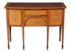 A George III mahogany and inlaid sideboard , early 19th century, of bowfront outline, in the manner