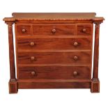A Victorian mahogany chest of drawers , mid 19th century, the shaped top above flanking columns and
