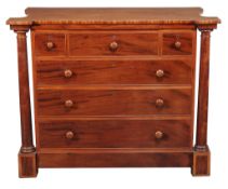A Victorian mahogany chest of drawers , mid 19th century, the shaped top above flanking columns and