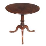 A George III mahogany tripod table , circa 1780, 69cm high, the tilt top 74cm diameter Provenance: