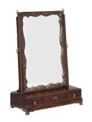 A George II mahogany dressing mirror, circa 1750, the mirror plate within a carved and parcel gilt