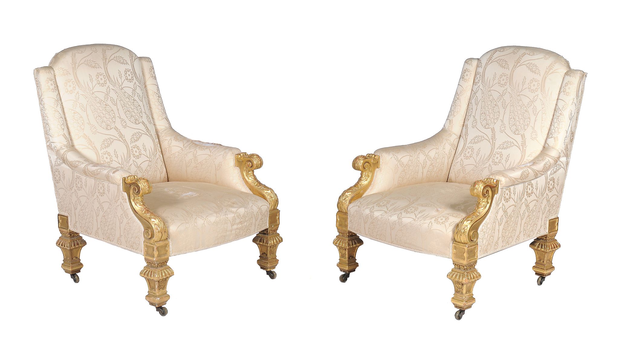 A pair of Victorian carved giltwood and gesso armchairs, circa 1860, in the manner of Holland &