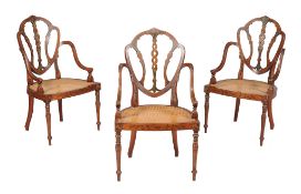 A set of three Victorian satinwood and polychrome painted elbow chairs, circa 1860, decorated