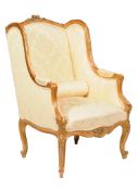 A giltwood and yellow damask upholstered armchair in Louis XVI style, early 20th century, 110cm