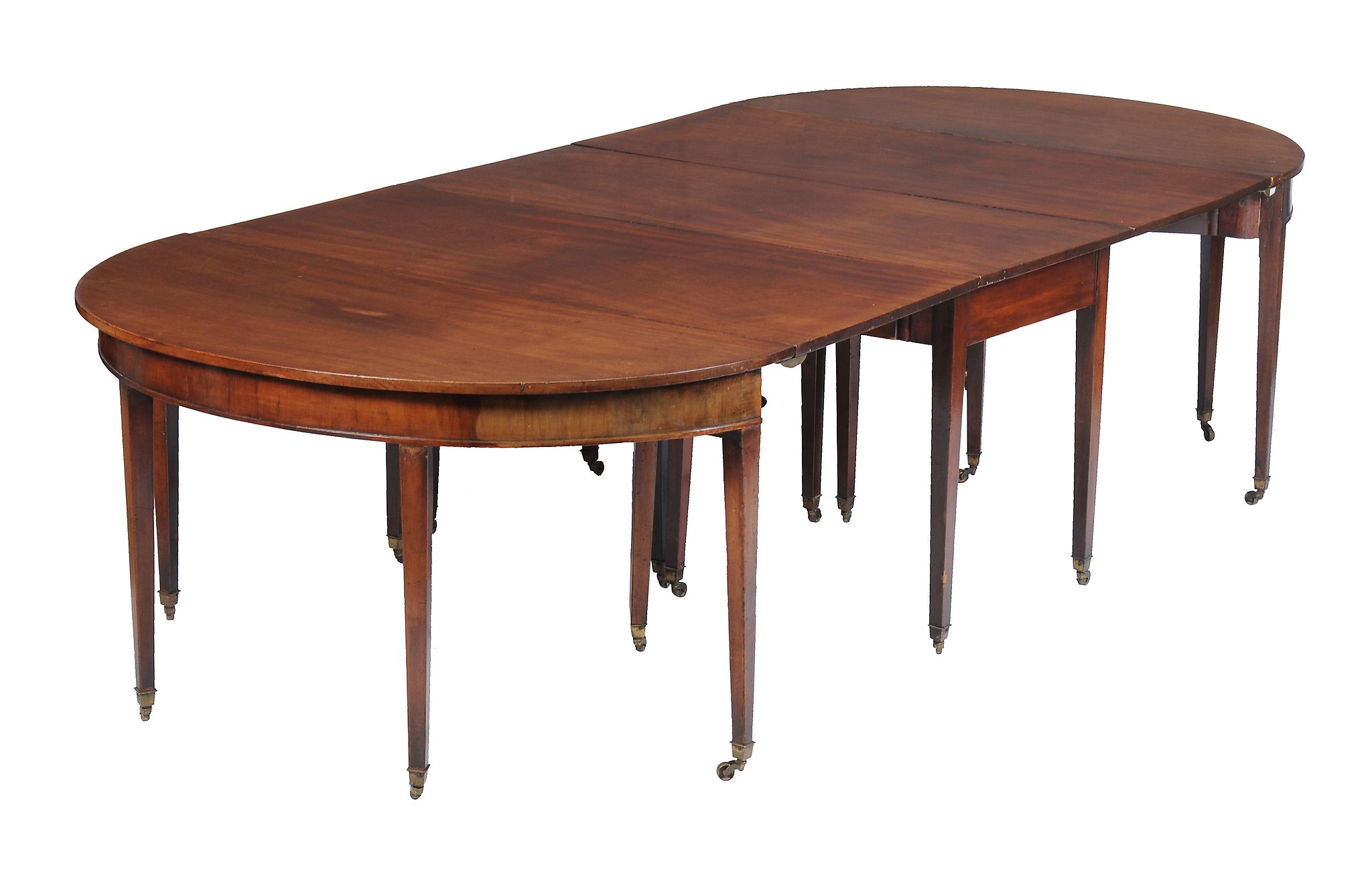 A George III mahogany dining table , early 19th century, with two additional leaves, 561cm long