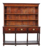 A George III oak potboard dresser base , late 18th century, with an associated plate rack canopy,