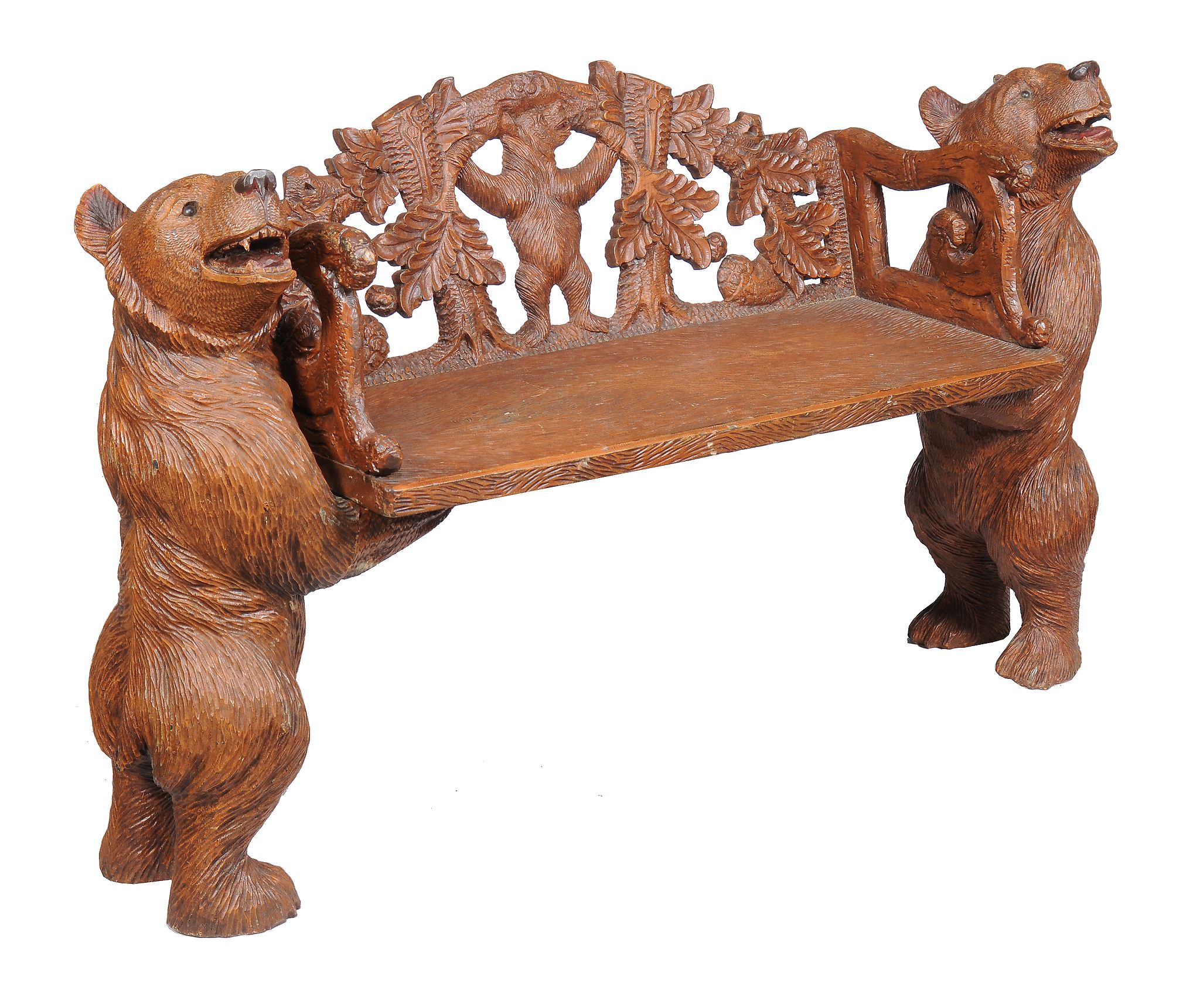 A carved wood hall seat, in the manner of Black Forest examples, 20th century, each end in the form