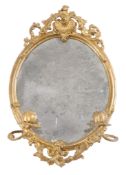 A pair of Victorian gilt composition girandole wall mirrors , second half 19th century, each oval