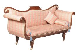 A George IV mahogany sofa, circa 1825, attributed to Gillows, the yoke shaped back centred by a