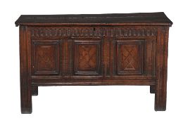 A panelled oak and inlaid chest, mid 17th century, the triple panelled front with line inlaid
