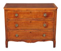 A George III harewood and line inlaid commode, circa 1800, with three long drawers, 94cm high,