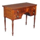 A George IV mahogany and line inlaid dressing table , circa 1825, 81cm high, 99cm wide, 54cm deep