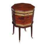 A George III mahogany and brass bound octaganal wine cooler , circa 1780, the lid with axe-head