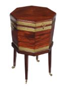 A George III mahogany and brass bound octaganal wine cooler , circa 1780, the lid with axe-head