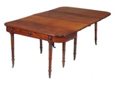 A Regency mahogany dining table , circa 1815, with two original and two later leaf insertions, with