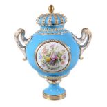 A Coalport bleu celeste ground Sevres-style two-handled urn and cover, circa 1855, painted in the