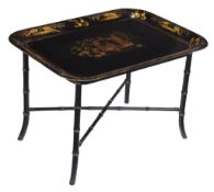 A black lacquer and parcel gilt painted metal tray table on a simulated bamboo stand , 19th