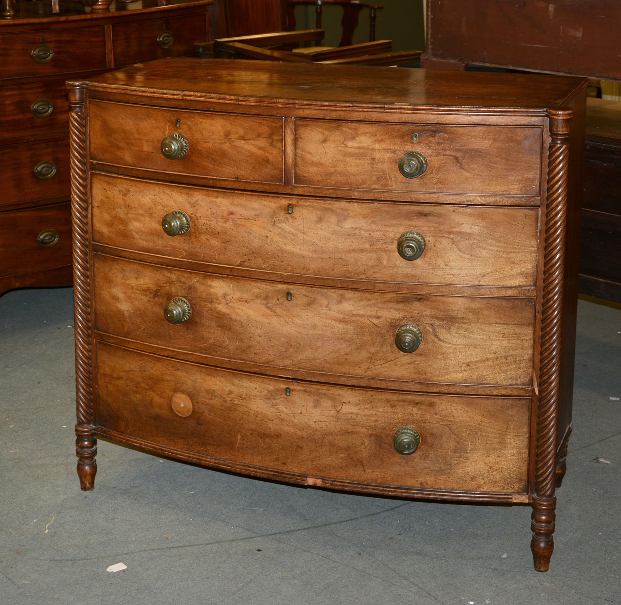 Ω A George IV mahogany and rosewood banded chest of drawers, circa 1825, 103cm high, 114cm wide