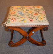 Ω A Regency rosewood X-frame foot stool with later upholstered seat, 35cm high, the