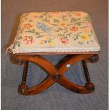 Ω A Regency rosewood X-frame foot stool with later upholstered seat, 35cm high, the