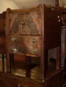 A George III mahogany night commode, with tray top above cupboard and sliding base with compartment,