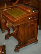 A Victorian walnut Davenport, with cupboard to one side concealing a bank of four drawers, 89cm high