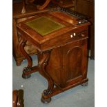 A Victorian walnut Davenport, with cupboard to one side concealing a bank of four drawers, 89cm high