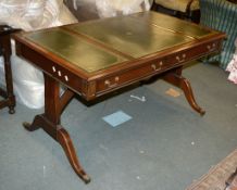 A stained wood library table in Regency style, of recent manufacture, with two short frieze