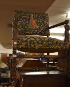A carved oak and beech armchair in 17th century style, 20th century, with tapestry upholstery