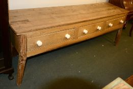 A Victorian pine dresser base, each drawer with white ceramic handles, 217cm long