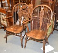 A pair of beech and elm Windsor armchairs, 20th century, each stamped F H to rear of chair seat