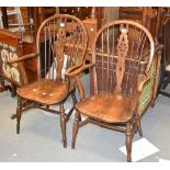 A pair of beech and elm Windsor armchairs, 20th century, each stamped F H to rear of chair seat