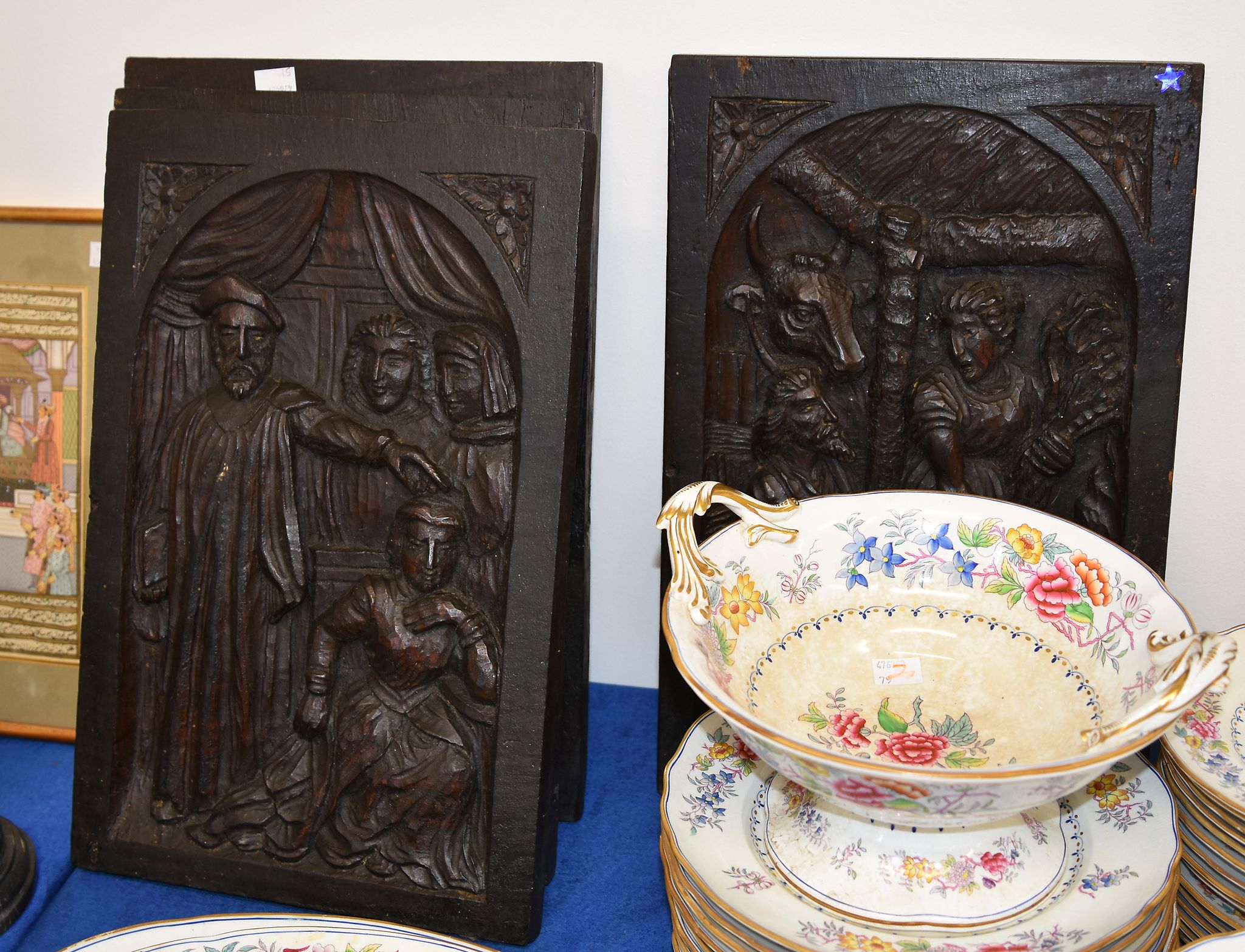 A set of four relief carved and stained wood panels depicting figural scenes, 20th century, 46 x