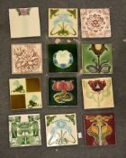 A box containing a quantity of various tiles, printed and Majolica type